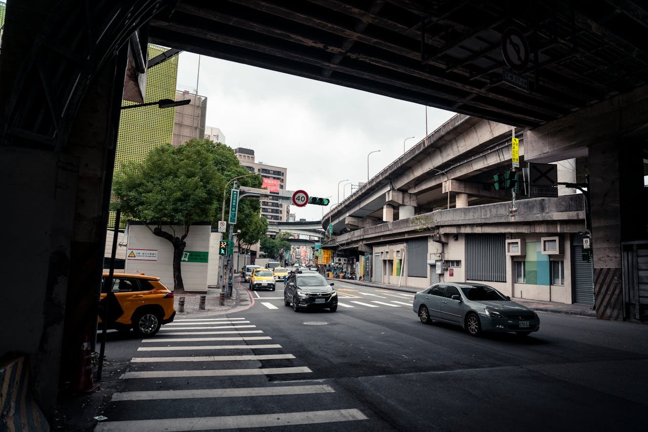 hero-img-01 Bustling street view under overpass in Taipei, Taiwan.